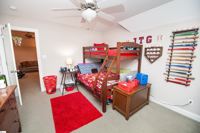 carpeted bedroom featuring baseboards and a ceiling fan