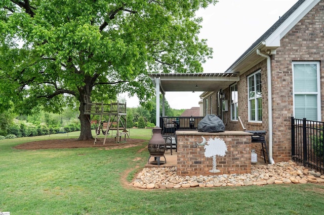view of green lawn featuring a patio area