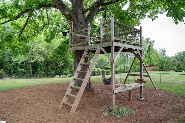 view of play area featuring view of wooded area