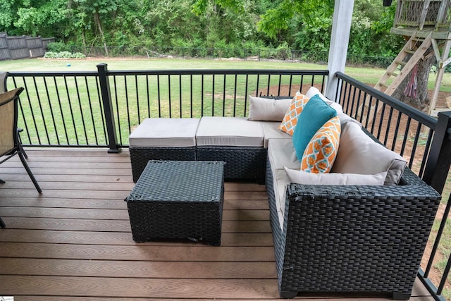 wooden terrace with an outdoor hangout area