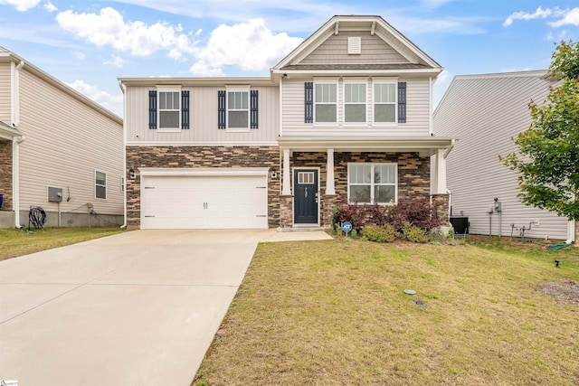 737 Rockhurst Way, Woodruff, SC 29388 - craftsman-style home featuring stone siding, a front lawn, concrete driveway, an attached garage, and covered porch