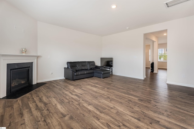 737 Rockhurst Way, Woodruff, SC 29388 - living room with dark wood-type flooring, baseboards, a glass covered fireplace, and recessed lighting