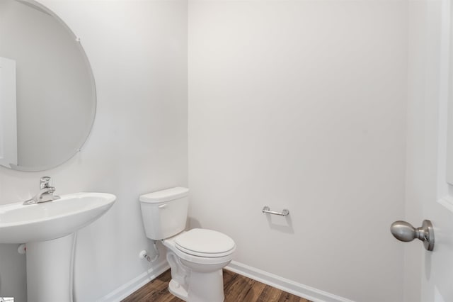737 Rockhurst Way, Woodruff, SC 29388 - bathroom with wood finished floors, toilet, and baseboards