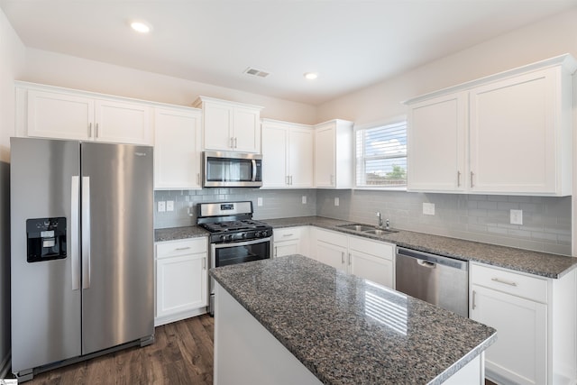 737 Rockhurst Way, Woodruff, SC 29388 - kitchen featuring stainless steel appliances, white cabinets, dark wood finished floors, decorative backsplash, and recessed lighting