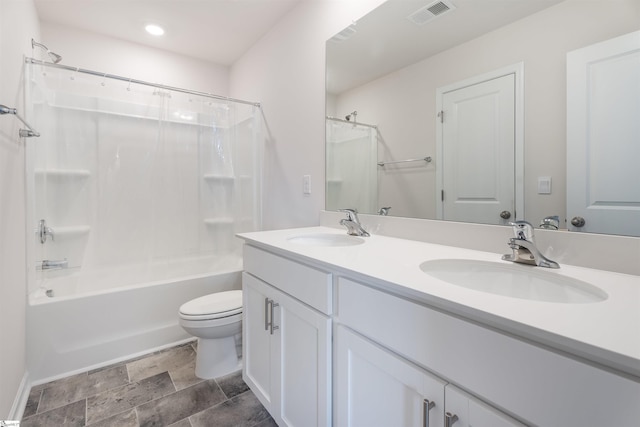 737 Rockhurst Way, Woodruff, SC 29388 - full bathroom featuring shower / bathtub combination with curtain, toilet, stone finish flooring, double vanity, and recessed lighting