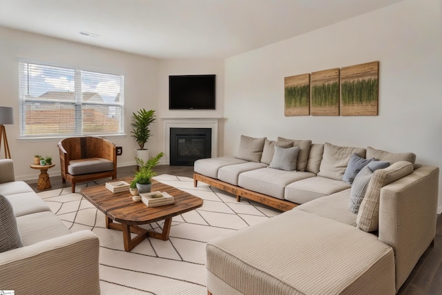 737 Rockhurst Way, Woodruff, SC 29388 - living area with light wood-type flooring, a glass covered fireplace, and baseboards