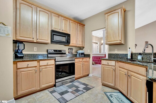 5 Laurelcrest Ln, Travelers Rest, SC 29690 - kitchen with black microwave, stainless steel electric range, light brown cabinetry, a sink, and dark stone countertops