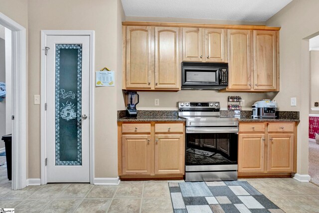 5 Laurelcrest Ln, Travelers Rest, SC 29690 - kitchen with black microwave, stainless steel electric stove, light brown cabinets, and dark stone countertops