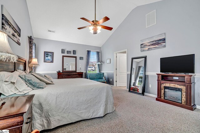 5 Laurelcrest Ln, Travelers Rest, SC 29690 - carpeted bedroom with high vaulted ceiling, a ceiling fan, and a glass covered fireplace