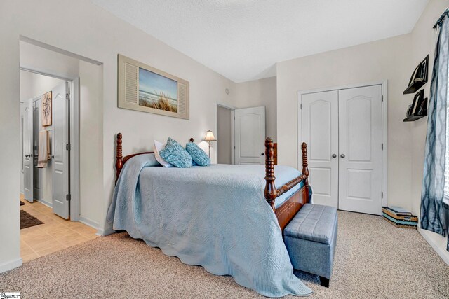 5 Laurelcrest Ln, Travelers Rest, SC 29690 - carpeted bedroom featuring a closet, baseboards, ensuite bath, and tile patterned floors