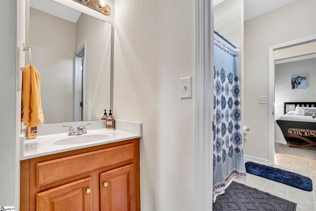 5 Laurelcrest Ln, Travelers Rest, SC 29690 - bathroom featuring vanity, tile patterned floors, and connected bathroom