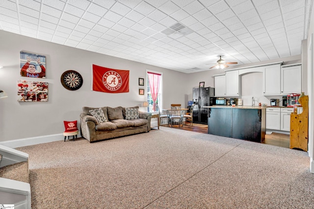 5 Laurelcrest Ln, Travelers Rest, SC 29690 - carpeted living area featuring a sink, a ceiling fan, and baseboards