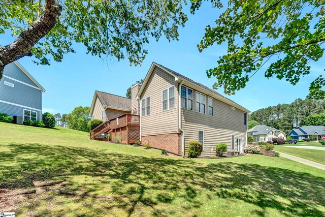 5 Laurelcrest Ln, Travelers Rest, SC 29690 - view of home's exterior with a yard, a wooden deck, stairs, and brick siding