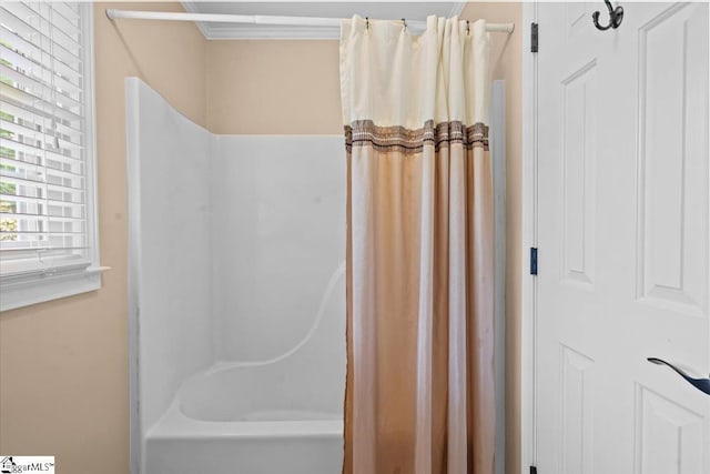 bathroom with shower / bath combination with curtain
