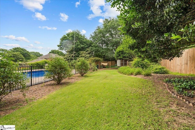 view of yard featuring a storage shed and an outbuilding