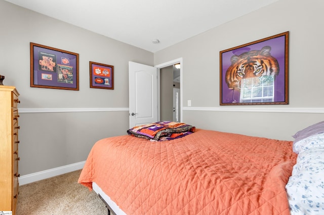 carpeted bedroom with baseboards