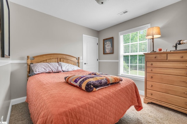 carpeted bedroom with baseboards