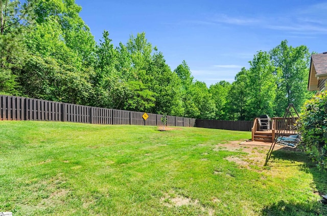view of yard with a wooden deck