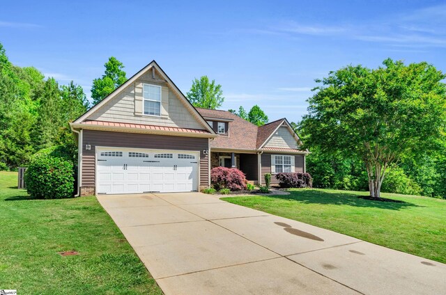 view of front facade featuring concrete driveway, a front lawn, and a standing seam roof