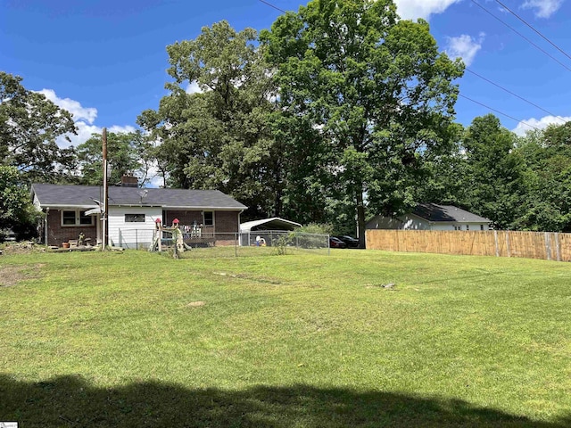 view of yard featuring a detached carport