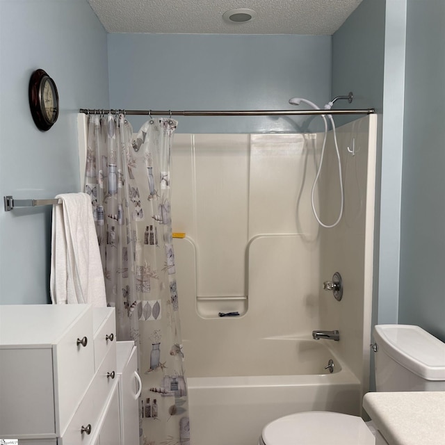full bath with toilet, shower / bath combo with shower curtain, a textured ceiling, and vanity