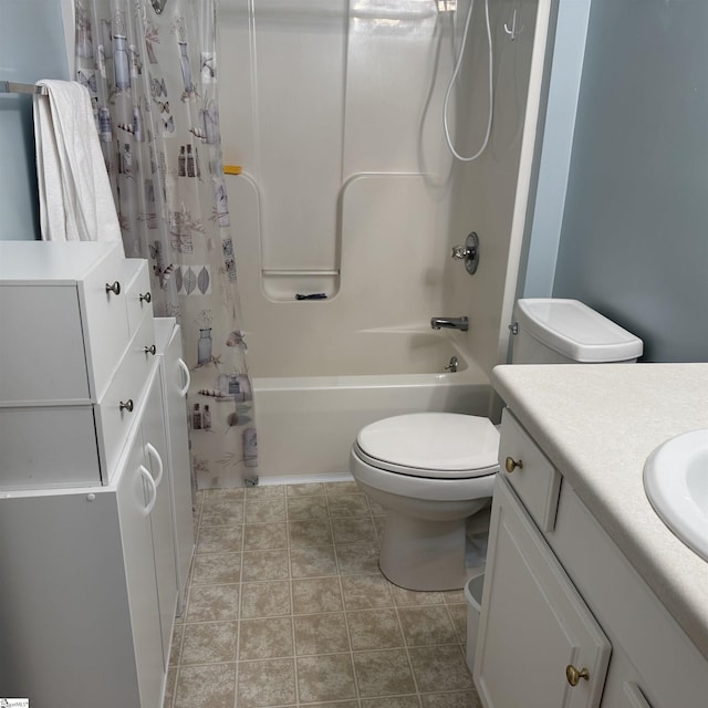 bathroom featuring shower / bath combination with curtain, toilet, and vanity