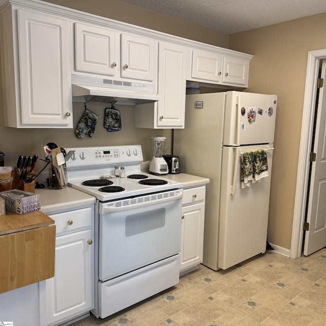 kitchen featuring white appliances, under cabinet range hood, white cabinetry, light countertops, and a textured ceiling