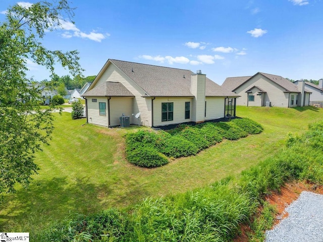 208 Laurel Trace Cir, Piedmont, SC 29673 - rear view of property featuring a chimney, a yard, a shingled roof, and cooling unit