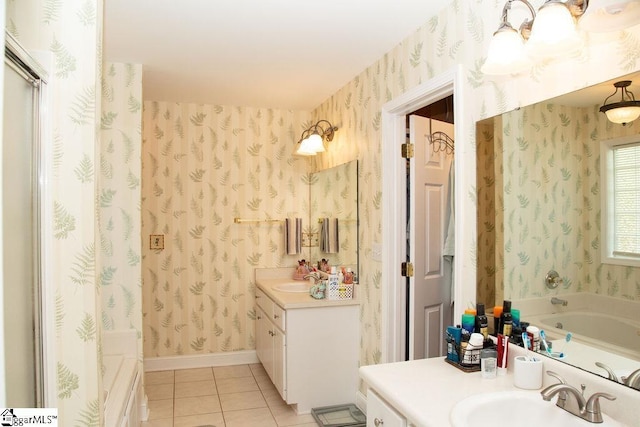 bathroom with wallpapered walls, tile patterned flooring, vanity, and a garden tub