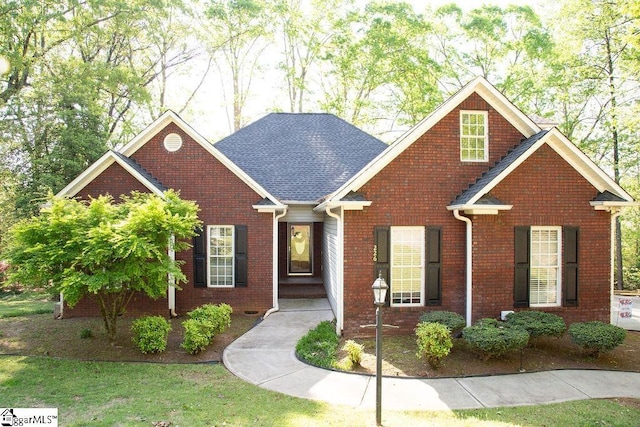 traditional-style home featuring brick siding