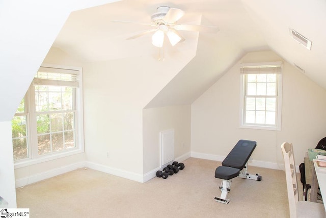 additional living space featuring lofted ceiling, plenty of natural light, carpet flooring, a ceiling fan, and baseboards