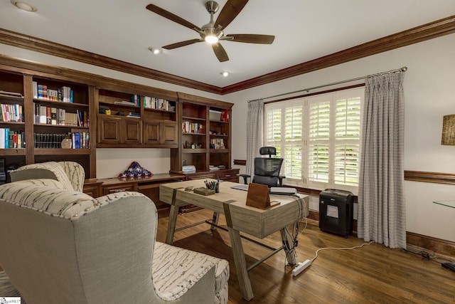 office space with a ceiling fan, wood finished floors, baseboards, and crown molding
