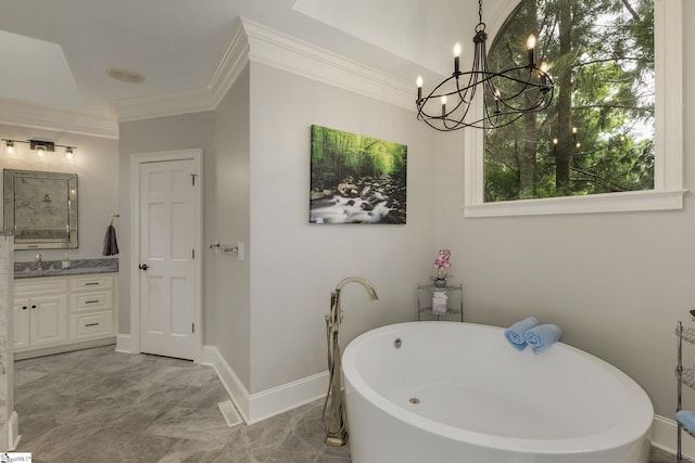 full bath featuring crown molding, a chandelier, marble finish floors, a soaking tub, and vanity