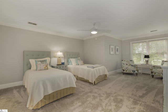 bedroom featuring crown molding, carpet flooring, baseboards, and a ceiling fan