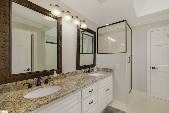 full bathroom with a stall shower, ornamental molding, tile patterned floors, double vanity, and baseboards