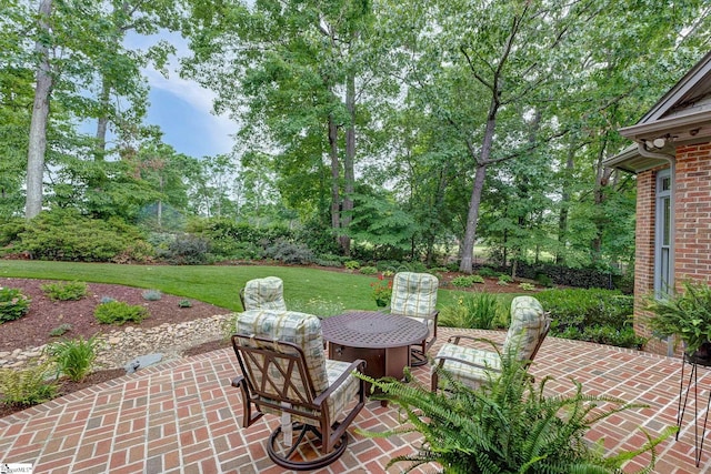 view of patio with view of wooded area