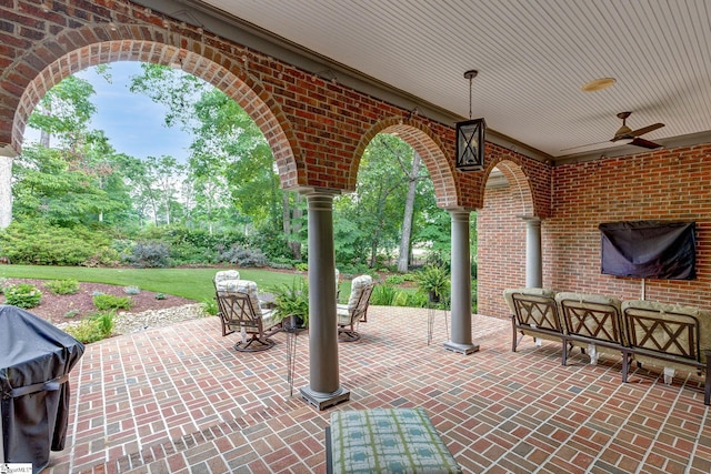 view of patio featuring area for grilling, a ceiling fan, and an outdoor hangout area