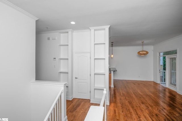 kitchen with ornamental molding, wood finished floors, baseboards, recessed lighting, and light countertops