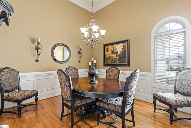 1008 Calumet Ct, Piedmont, SC 29673 - dining space featuring ornamental molding, plenty of natural light, a chandelier, light wood-style floors, and wainscoting