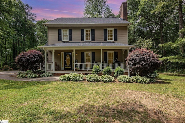 108 Ascot Ct, Easley, SC 29642 - view of front of home with a chimney, a front yard, and covered porch