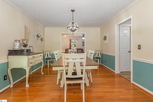 108 Ascot Ct, Easley, SC 29642 - dining area featuring ceiling fan, a chandelier, light wood finished floors, baseboards, and ornamental molding