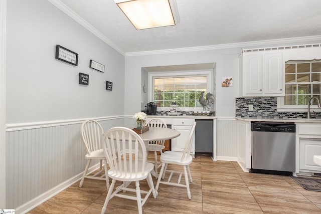 108 Ascot Ct, Easley, SC 29642 - kitchen featuring stainless steel dishwasher, crown molding, light countertops, white cabinetry, and tasteful backsplash