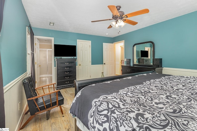 108 Ascot Ct, Easley, SC 29642 - bedroom with wood finished floors, wainscoting, a ceiling fan, and a closet
