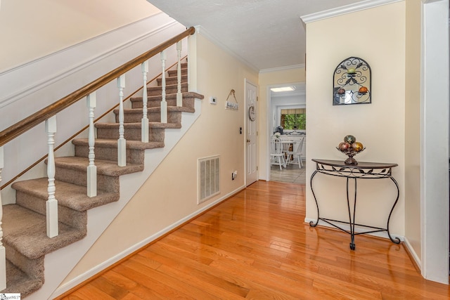 108 Ascot Ct, Easley, SC 29642 - staircase featuring wood finished floors, crown molding, and baseboards