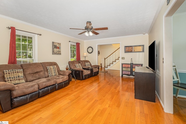 108 Ascot Ct, Easley, SC 29642 - living room featuring light wood-style floors, ceiling fan, stairway, and crown molding