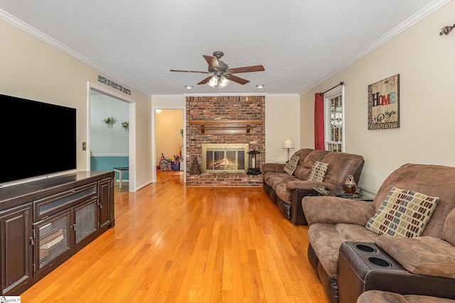 108 Ascot Ct, Easley, SC 29642 - living room with ceiling fan, light wood-type flooring, a brick fireplace, crown molding, and baseboards