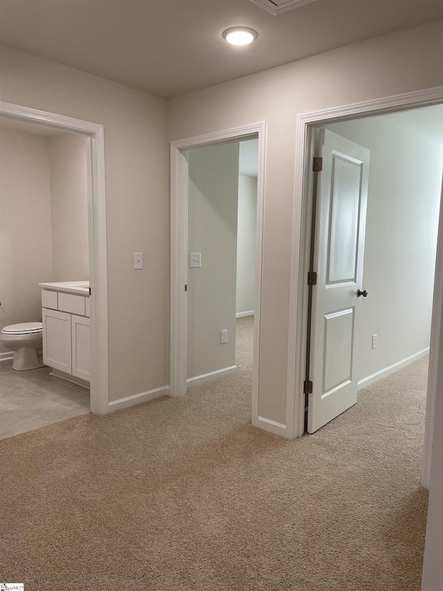corridor with carpet floors, baseboards, and recessed lighting