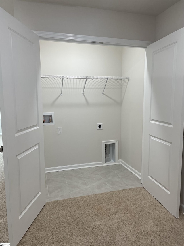 clothes washing area with hookup for a washing machine, hookup for an electric dryer, light colored carpet, and baseboards
