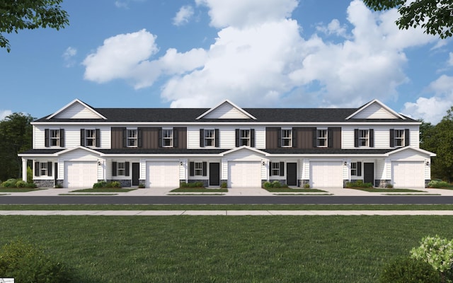 multi unit property featuring stone siding, a front lawn, and a garage