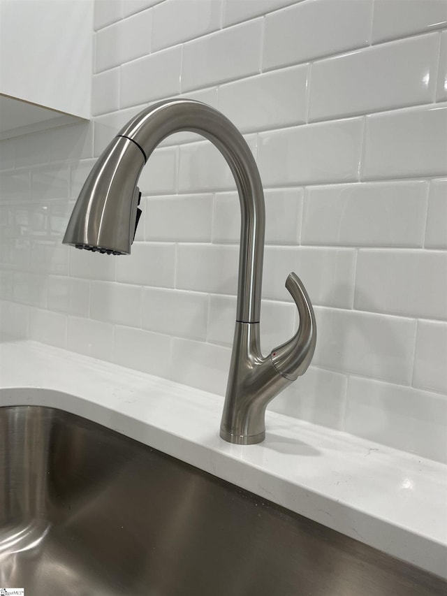 detailed view of a sink and backsplash